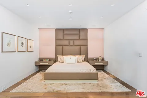 a living room with furniture and a dining table
