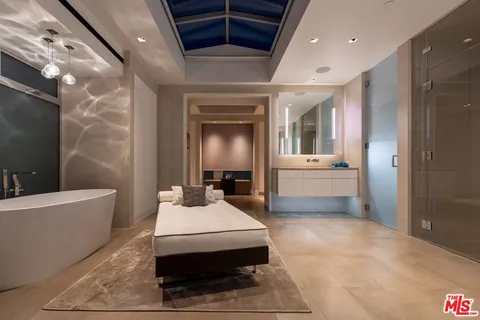 a bathroom with a double vanity sink tub and mirror