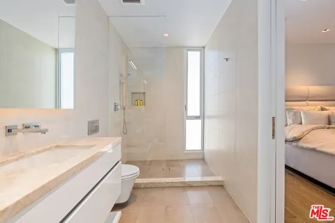 a kitchen that has a sink and a stove