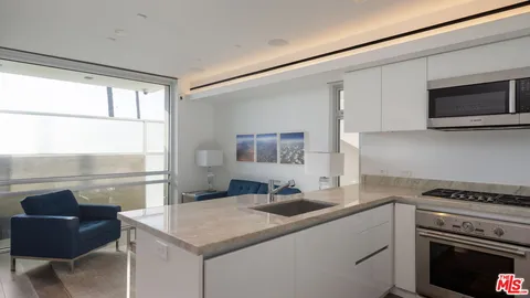 a bathroom with a sink toilet vanity and shower