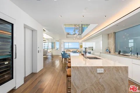 a view of a living room and dining room