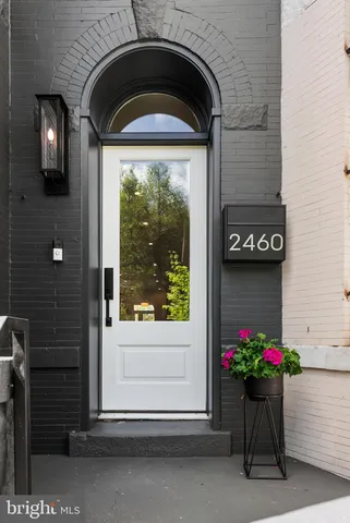 a front view of a house with flower