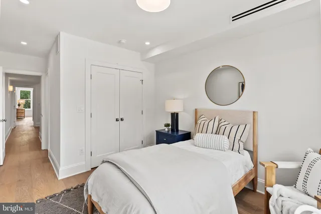 a en suite bathroom with a double vanity sink and a mirror