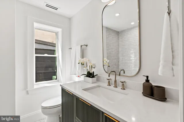 a view of a roof deck with wooden floor and furniture
