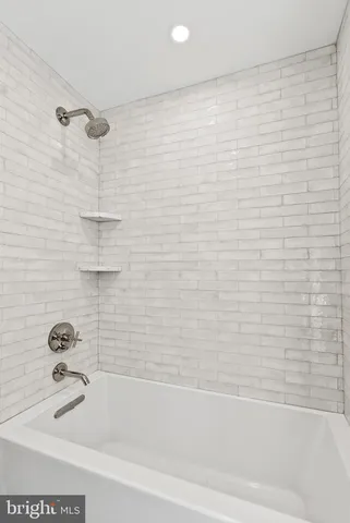 a room with wooden floor and furniture