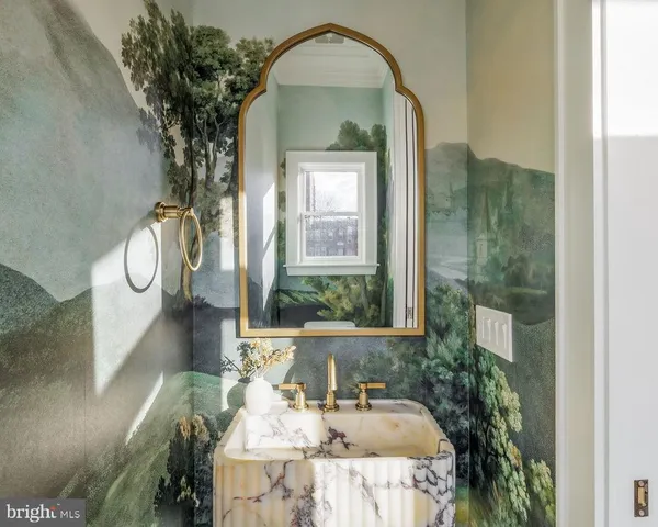 a view of a dry yard with wooden fence