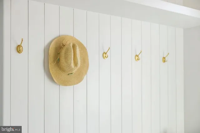 a large bed sitting in a bedroom next to a window