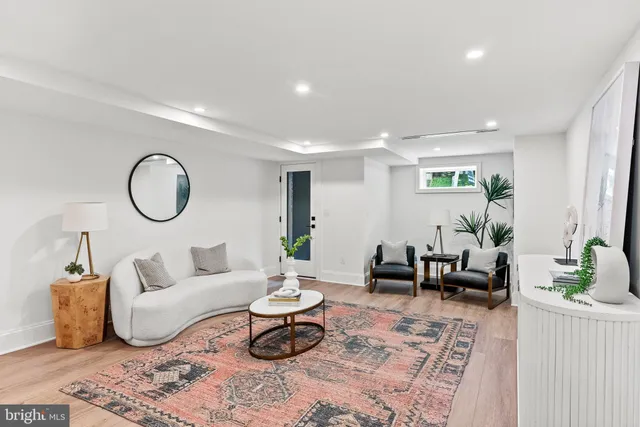 a view of a backyard with furniture and a garden
