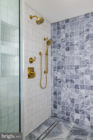 a bathroom with a toilet a sink and a mirror