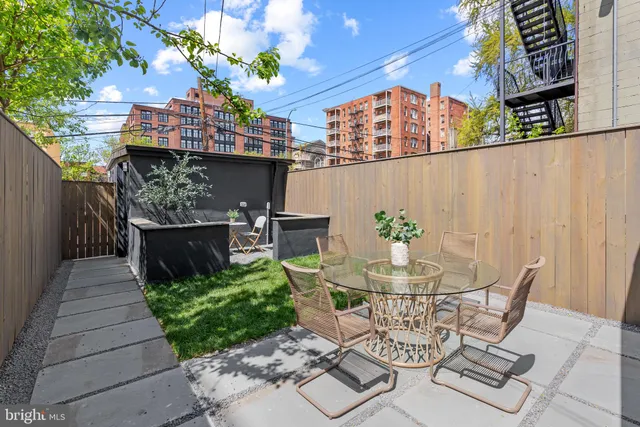 a view of a brick building with a window and door