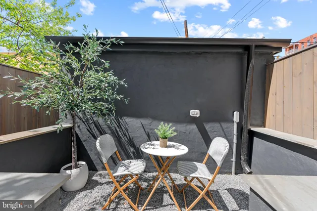 a view of a building with sitting area