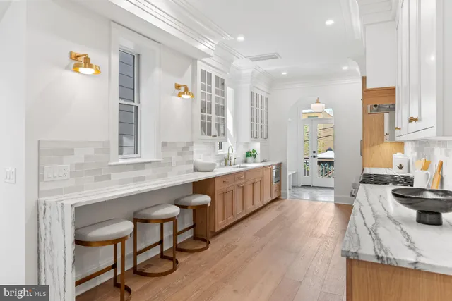 a kitchen with granite countertop a stove and a sink