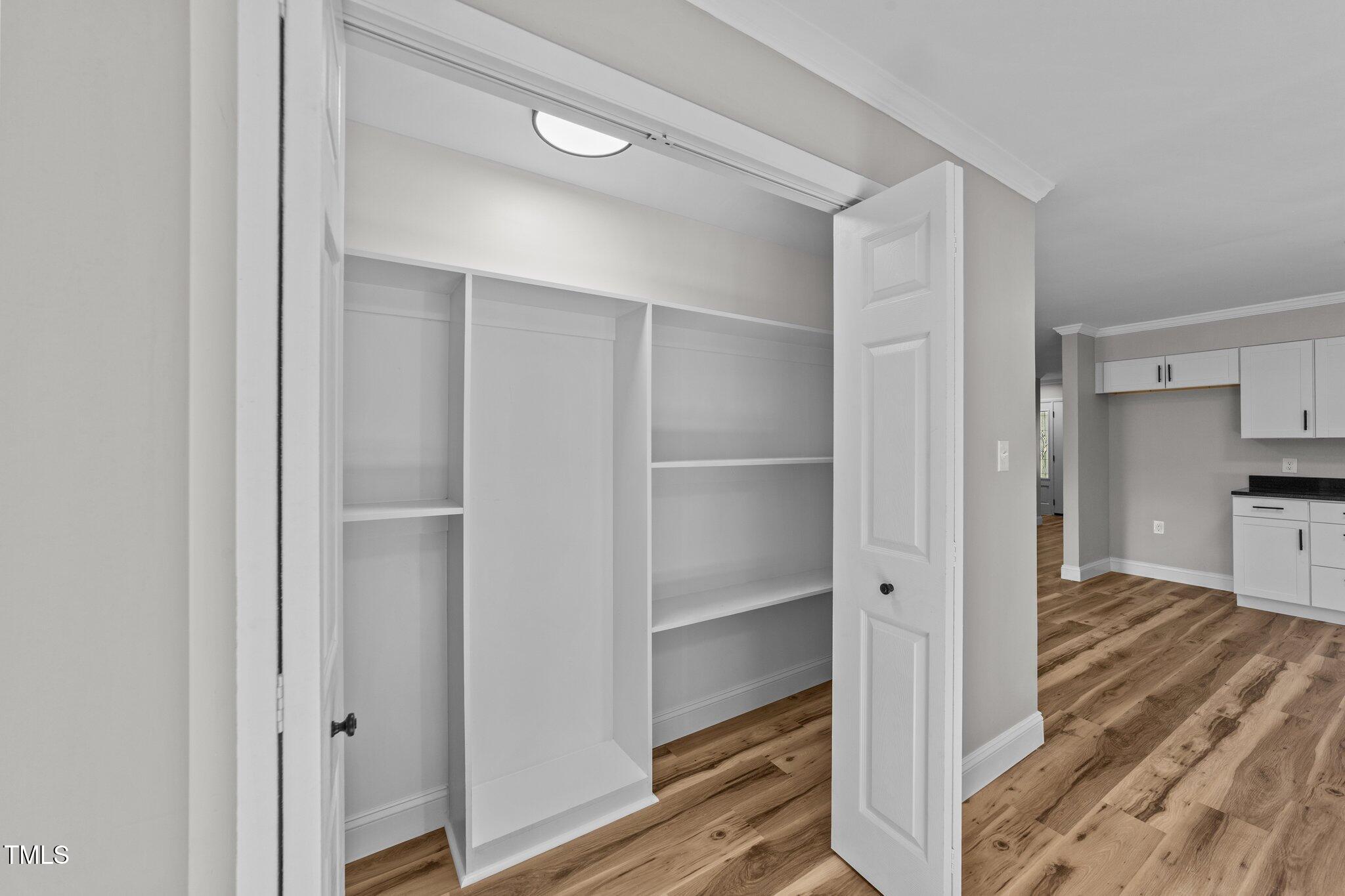 620 Richardson Road Zebulon, NC 27597 - Photo 21 of 52 a view of a walk in closet and bedroom