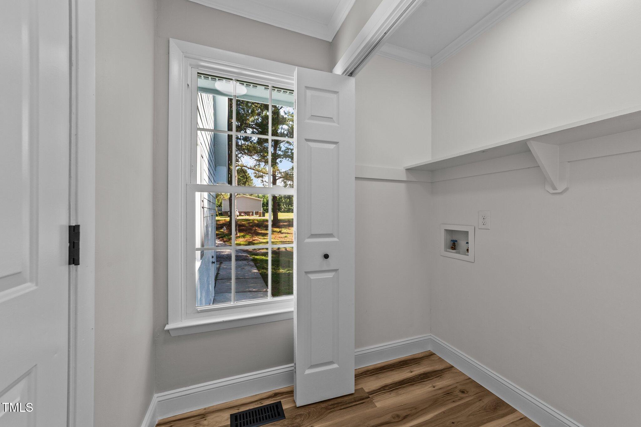 620 Richardson Road Zebulon, NC 27597 - Photo 23 of 52 a view of small space with wooden floor and windows
