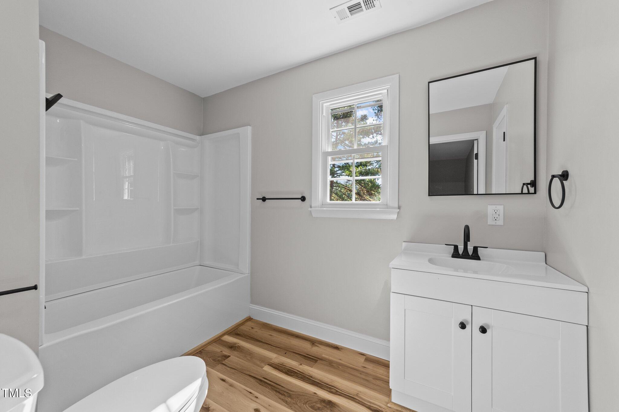 620 Richardson Road Zebulon, NC 27597 - Photo 36 of 52 a bathroom with a sink toilet and shower