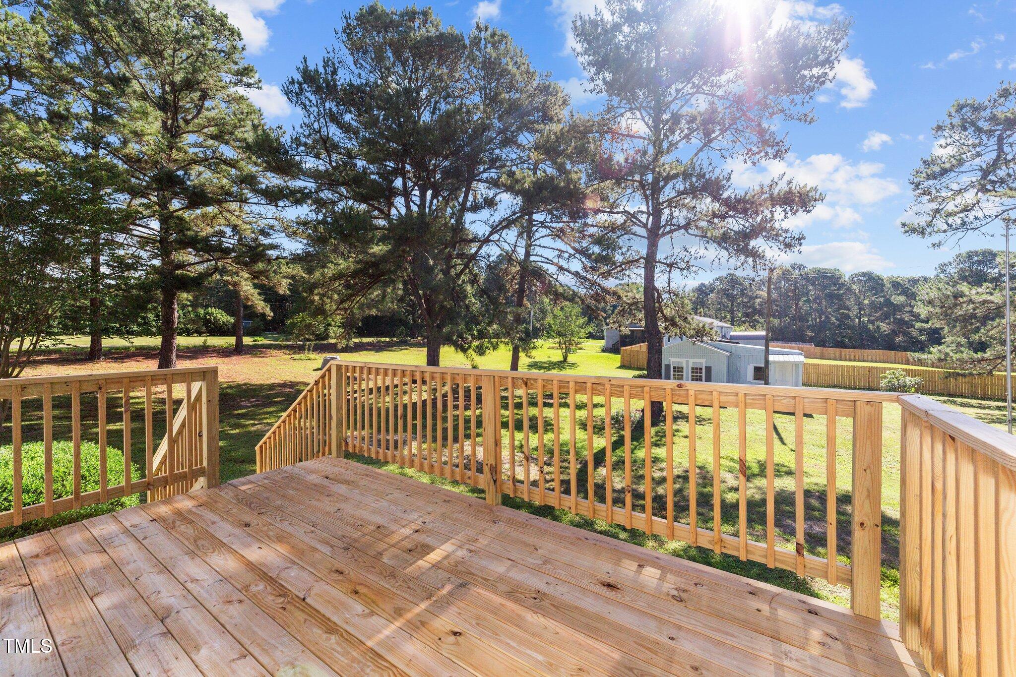 620 Richardson Road Zebulon, NC 27597 - Photo 37 of 52 a view of deck with large trees