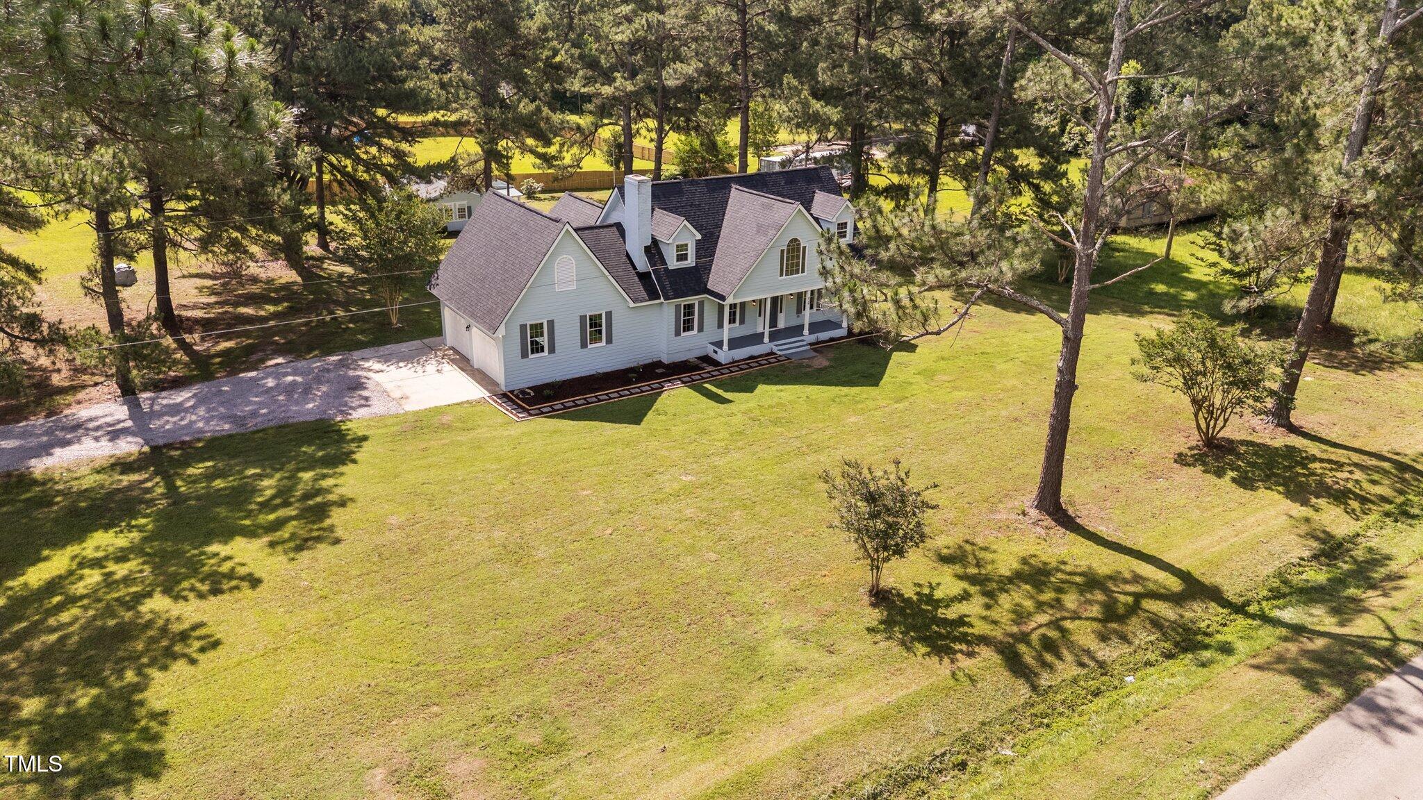 620 Richardson Road Zebulon, NC 27597 - Photo 4 of 52 a house view with swimming pool