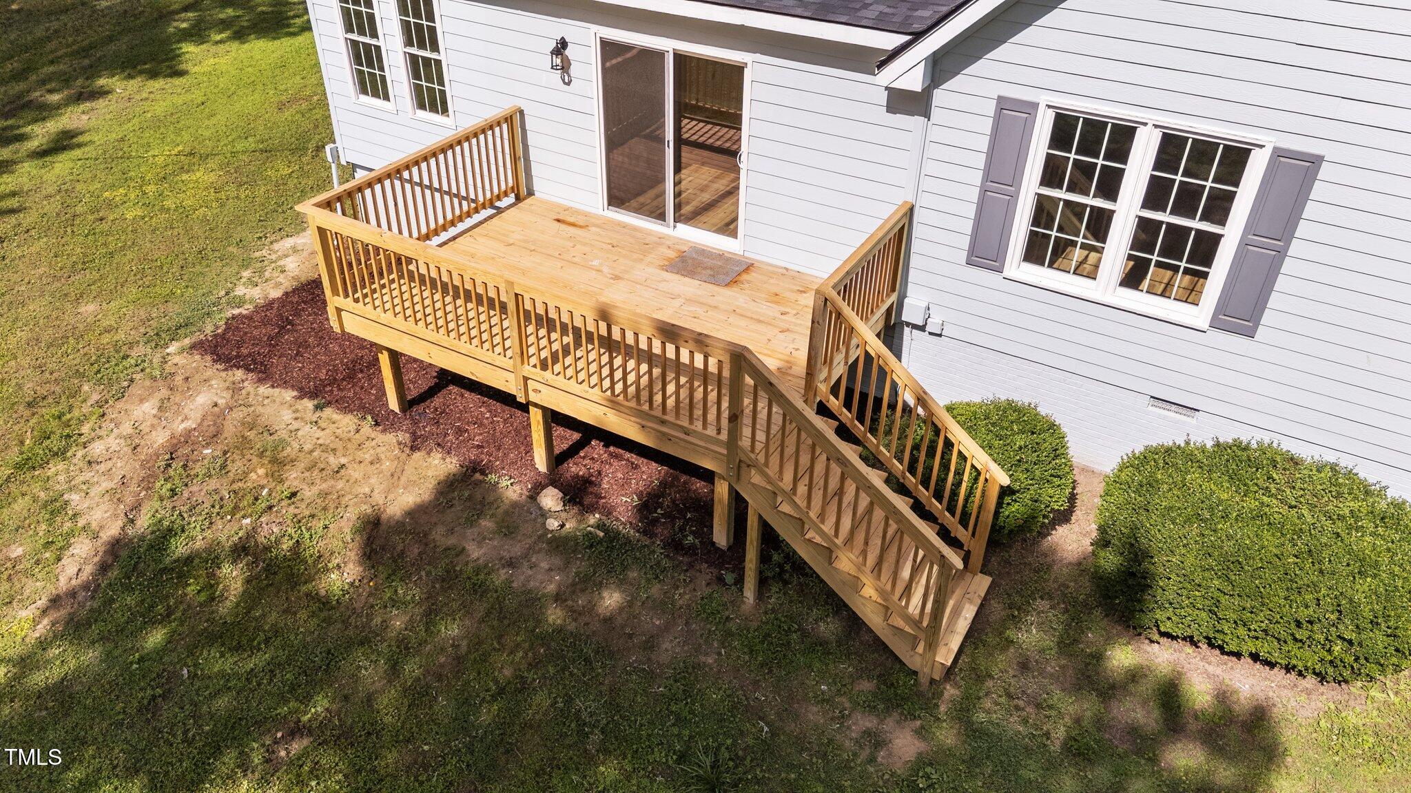 620 Richardson Road Zebulon, NC 27597 - Photo 42 of 52 a balcony with table and chairs