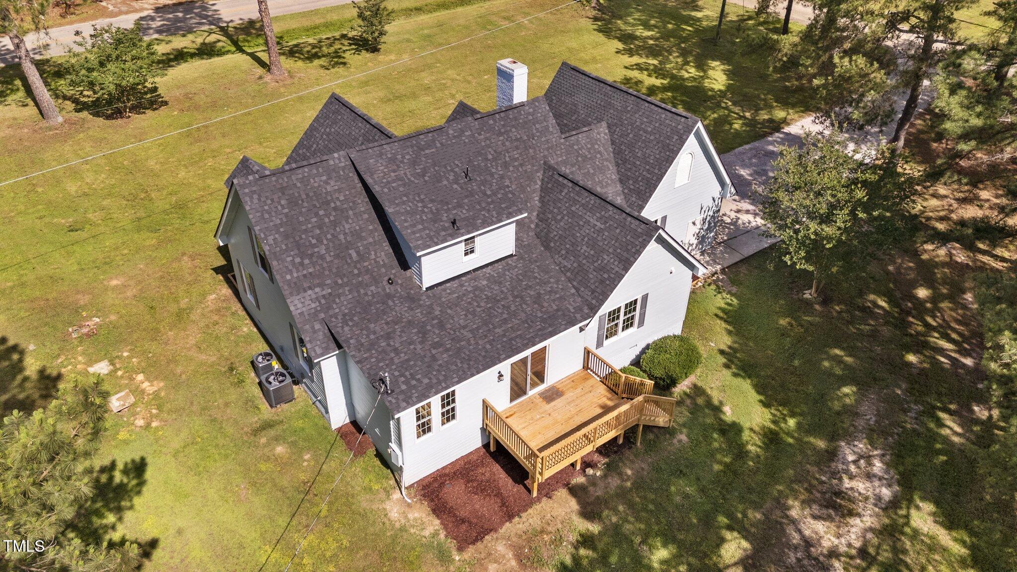 620 Richardson Road Zebulon, NC 27597 - Photo 43 of 52 a aerial view of a house with swimming pool