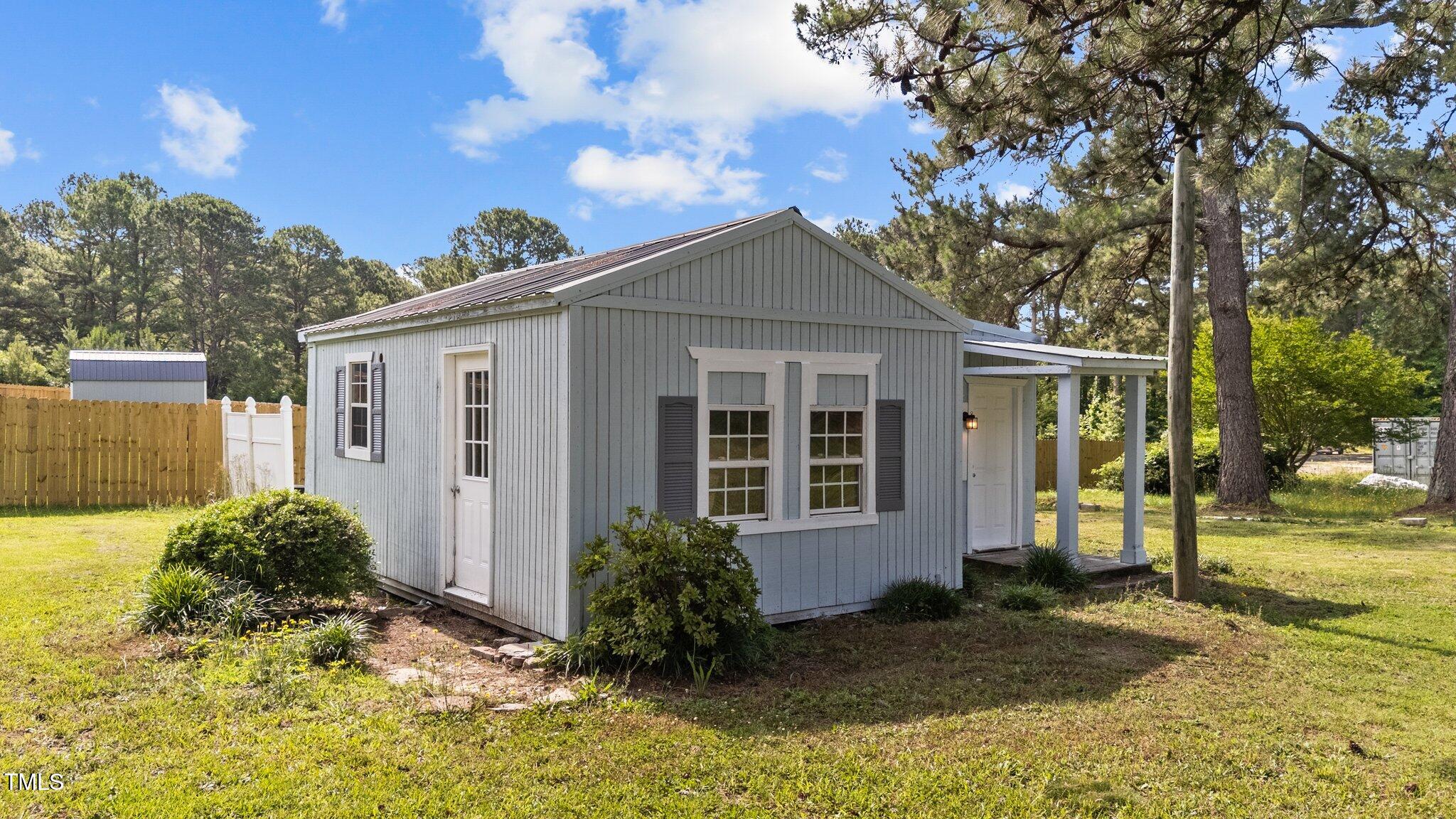 620 Richardson Road Zebulon, NC 27597 - Photo 47 of 52 a front view of a house with a yard