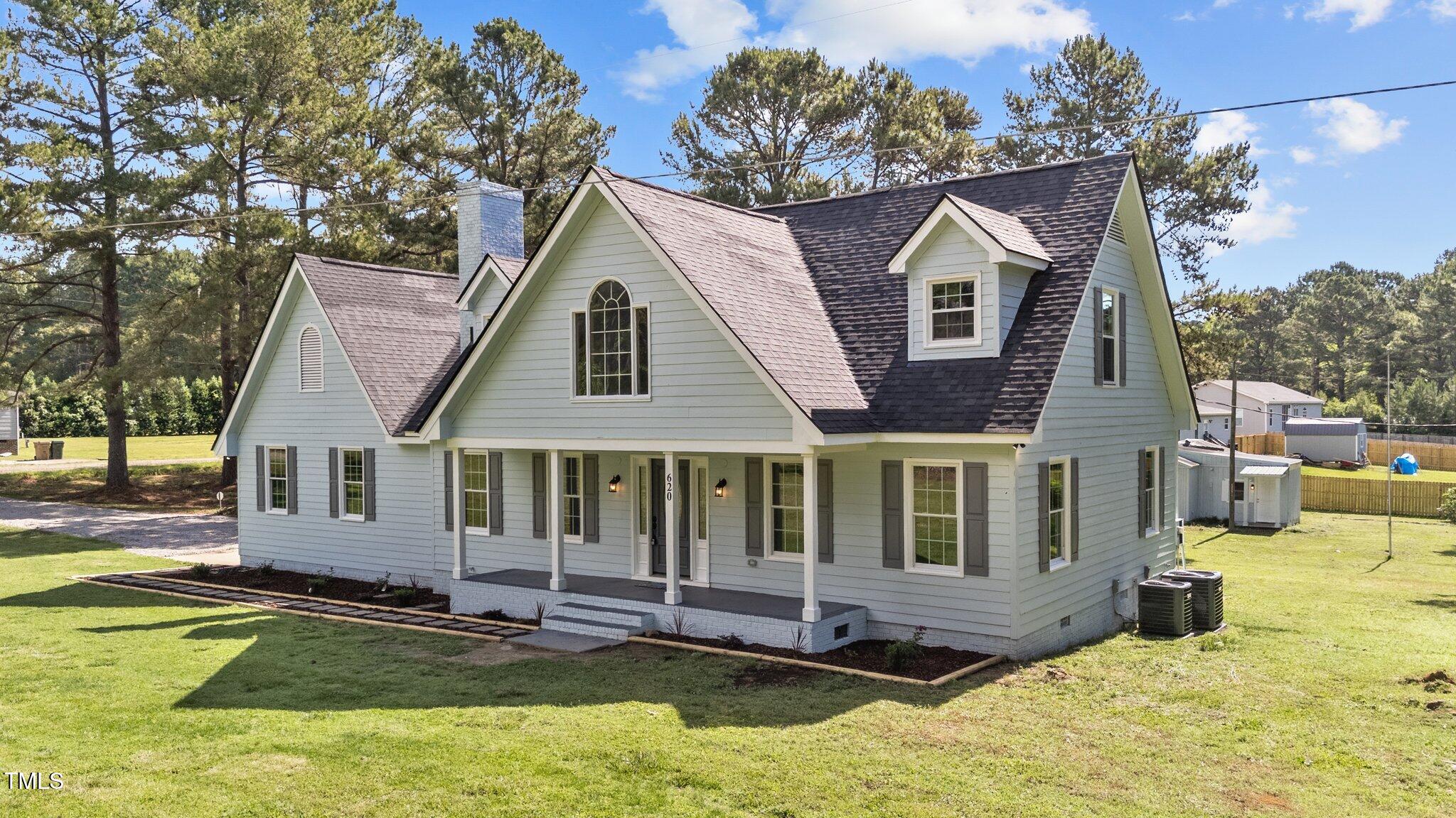 620 Richardson Road Zebulon, NC 27597 - Photo 6 of 52 a view of a house with pool and sitting area
