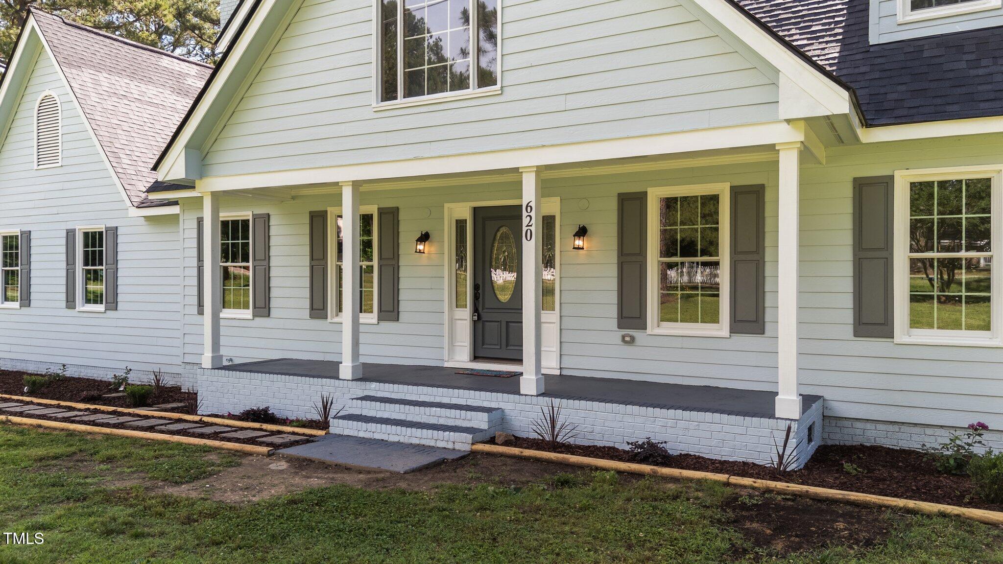 620 Richardson Road Zebulon, NC 27597 - Photo 7 of 52 a front view of a house with a yard
