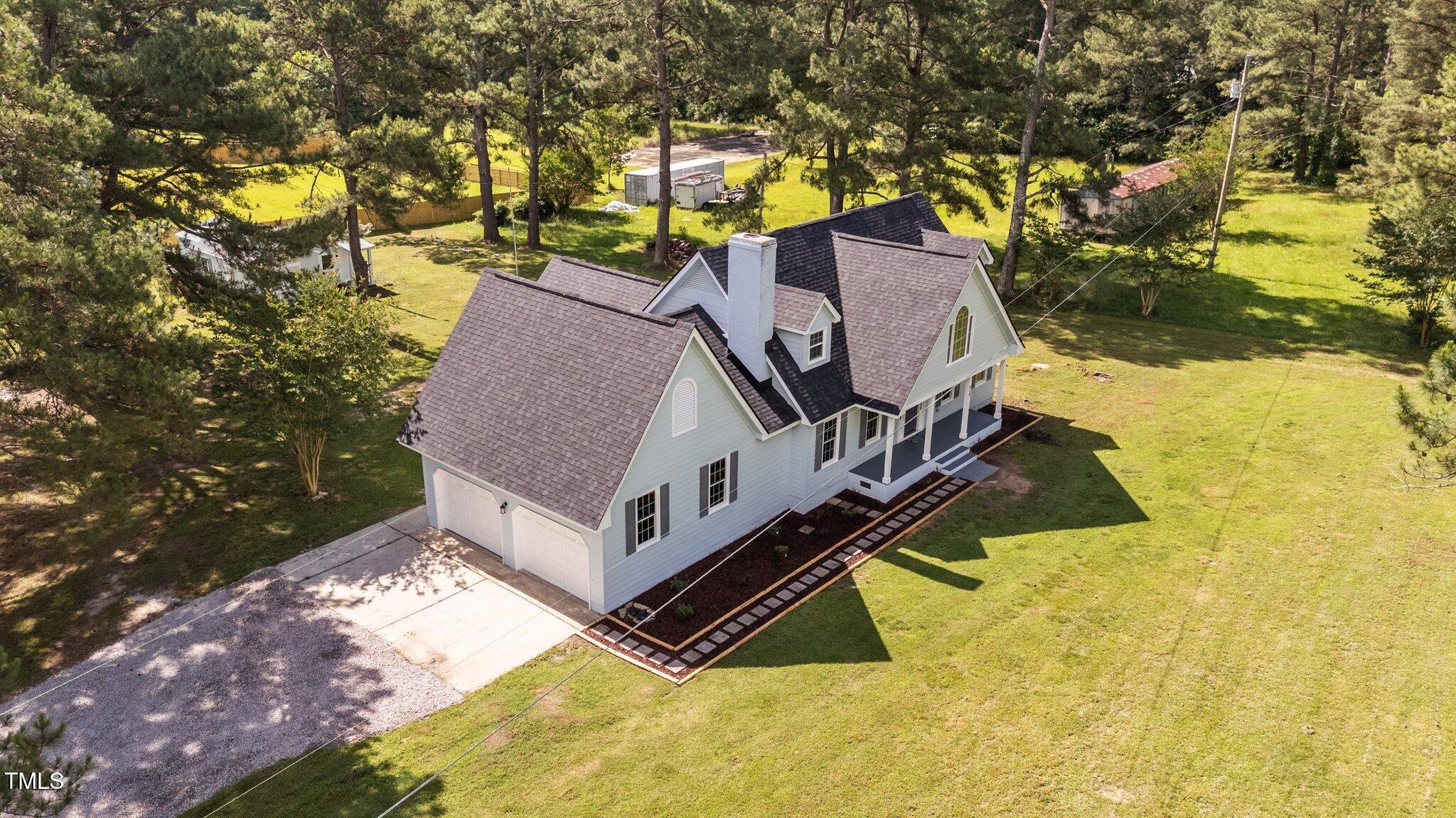 620 Richardson Road Zebulon, NC 27597 - Photo 9 of 52 a view of swimming pool with a yard and sitting area