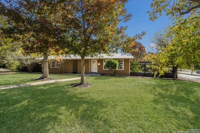 a view of a house with a yard