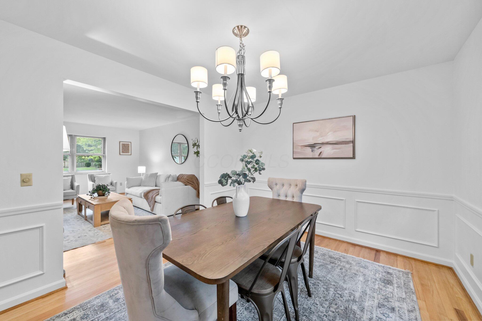 The formal fining room is off the living room and boasts wainscoting.