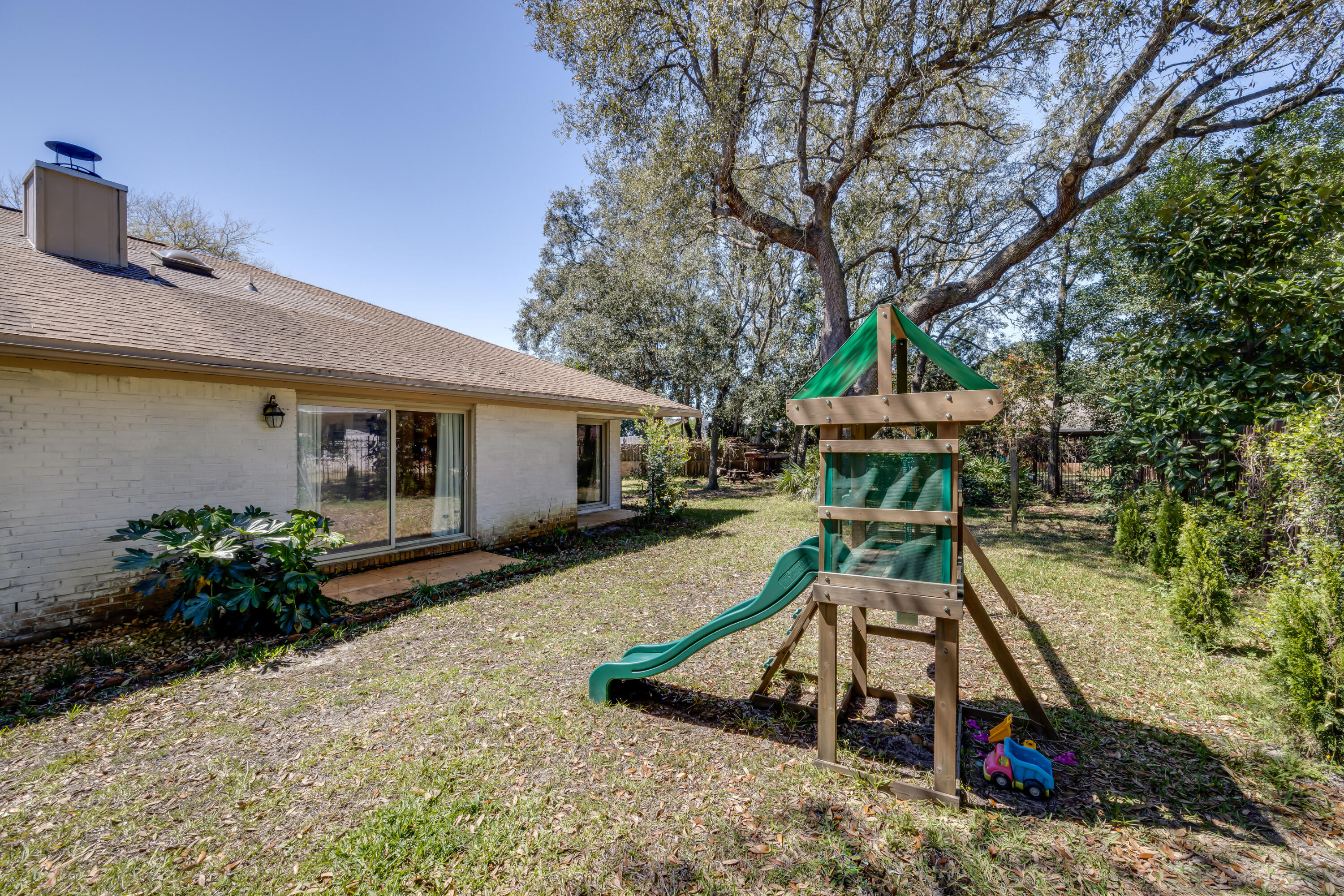 5 Cahaba Court Destin, FL 32541 - Photo 39 of 44 a house view with a sitting space and garden