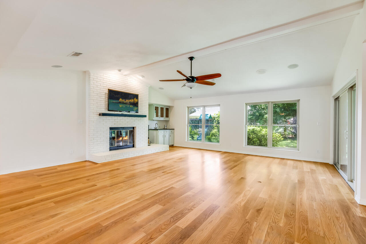 5 Cahaba Court Destin, FL 32541 - Photo 4 of 44 a view of empty room with fireplace and wooden floor