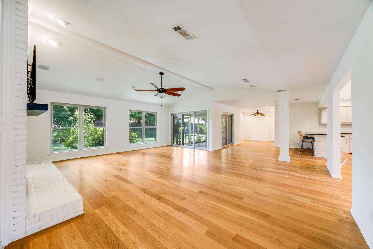 5 Cahaba Court Destin, FL 32541 - Photo 5 of 44 a view of an empty room with wooden floor and a window