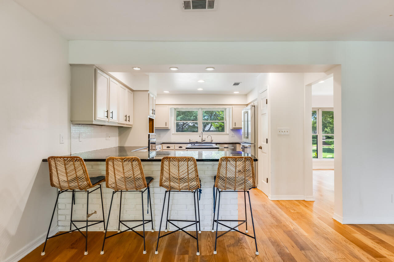 5 Cahaba Court Destin, FL 32541 - Photo 8 of 44 a view of a dining room with furniture and wooden floor