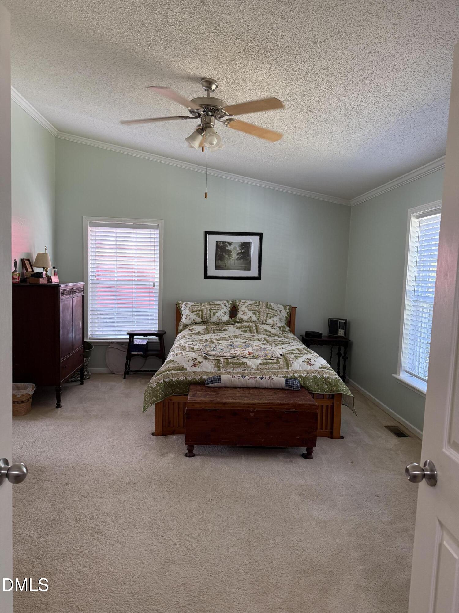 598 Ridge View Drive Cameron, NC 28326 - Photo 12 of 22 a bedroom with a bed and a chandelier