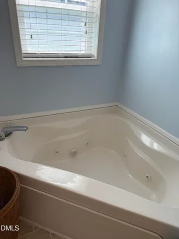 a close up of a bathtub in a bathroom