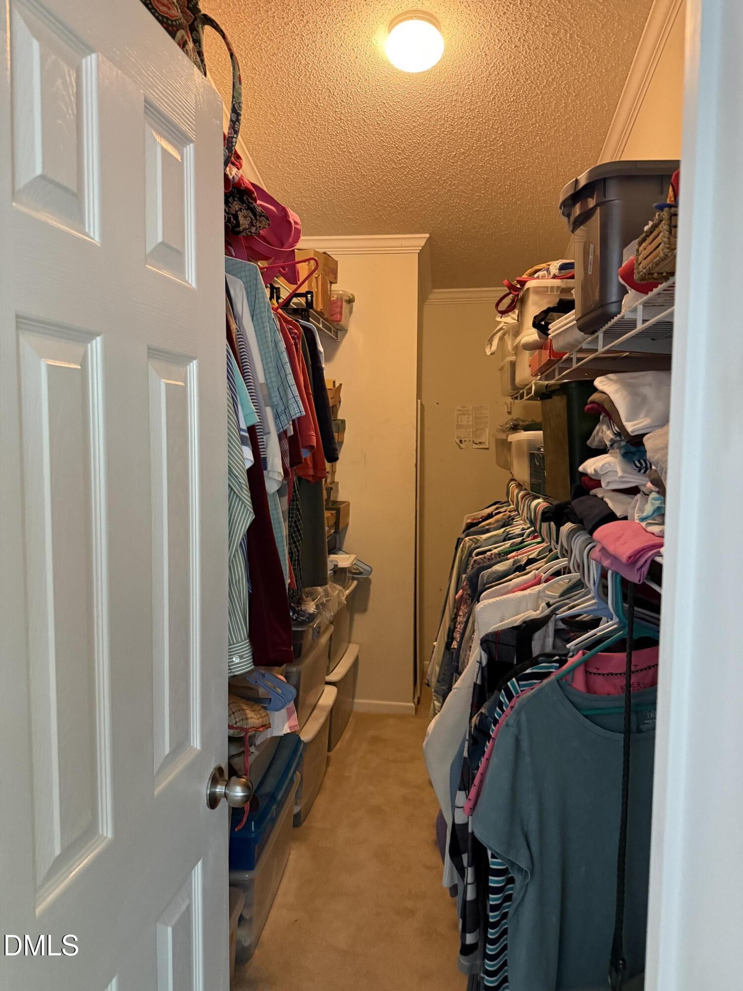 598 Ridge View Drive Cameron, NC 28326 - Photo 16 of 22 a view of walk in closet with clothes and shoes