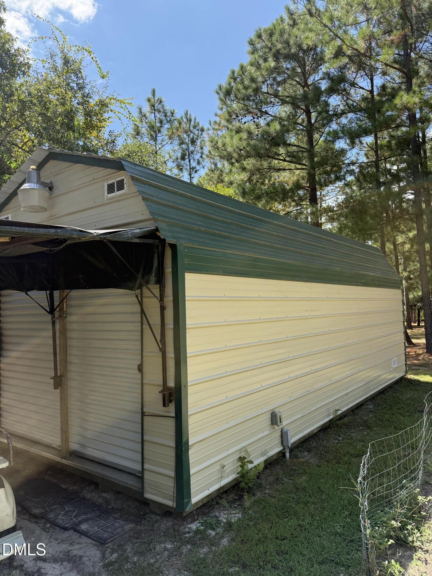 598 Ridge View Drive Cameron, NC 28326 - Photo 20 of 22 a backyard of a house with lots of green space