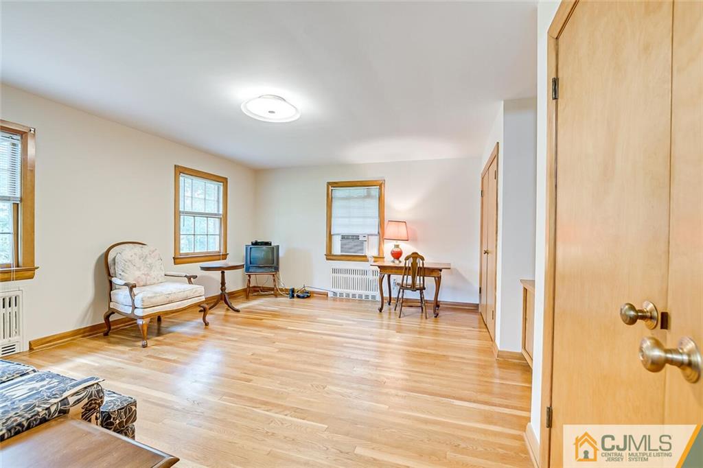 305 Ridge Road Watchung, NJ 07069 - Photo 11 of 41 a living room with furniture and a wooden floor
