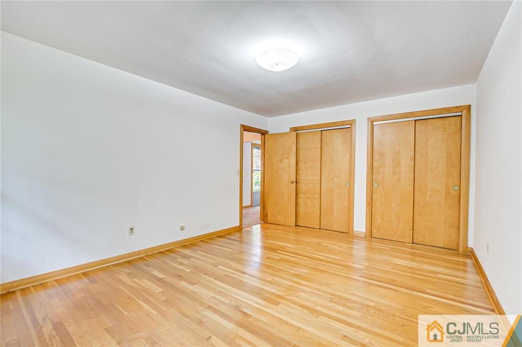 305 Ridge Road Watchung, NJ 07069 - Photo 13 of 41 a view of an empty room with wooden floor and a window