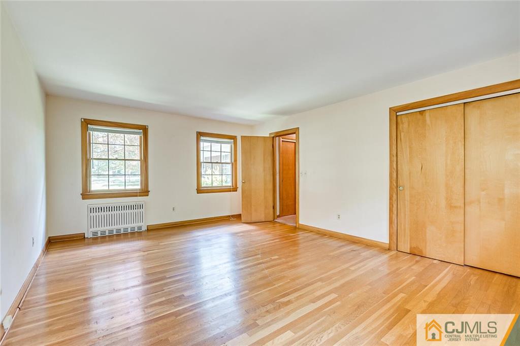 305 Ridge Road Watchung, NJ 07069 - Photo 18 of 41 an empty room with wooden floor and windows