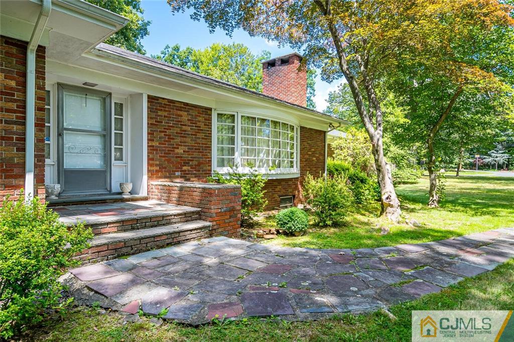 305 Ridge Road Watchung, NJ 07069 - Photo 2 of 41 a view of a house with backyard and garden