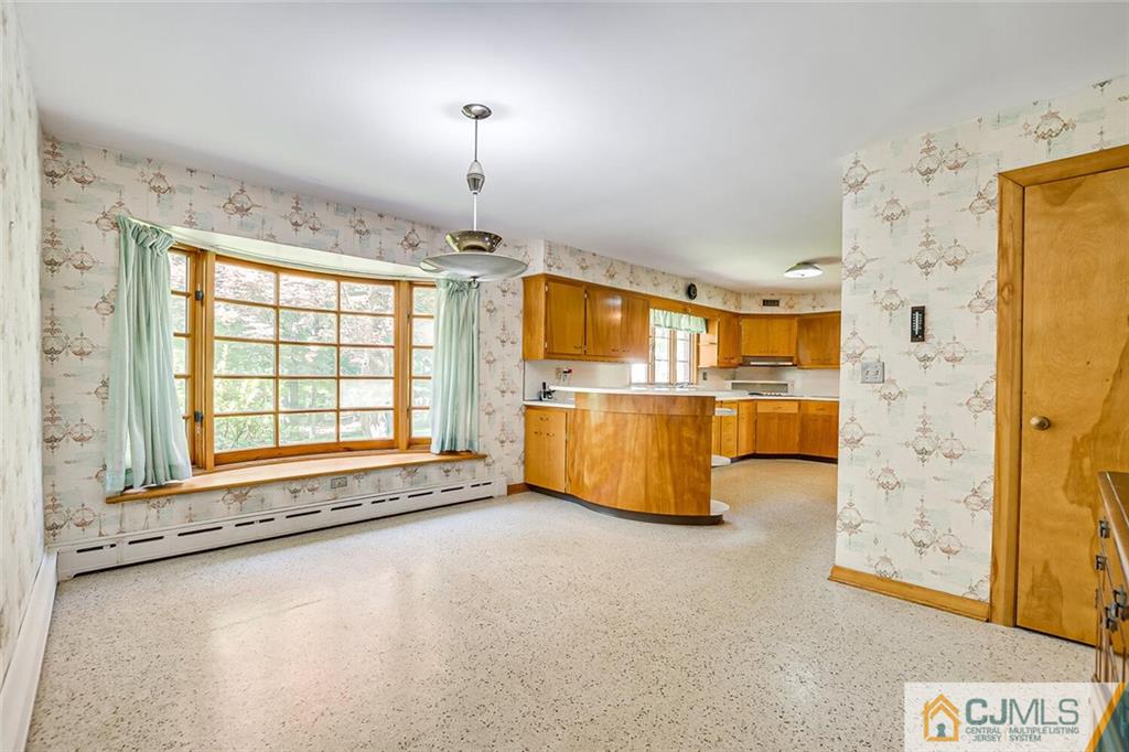 305 Ridge Road Watchung, NJ 07069 - Photo 21 of 41 a spacious bedroom with a bed and cabinets