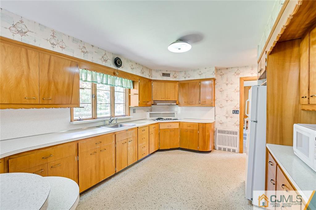 305 Ridge Road Watchung, NJ 07069 - Photo 22 of 41 a large white kitchen with a large window