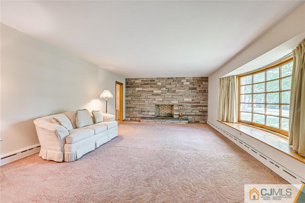 305 Ridge Road Watchung, NJ 07069 - Photo 9 of 41 a living room with furniture and a large window