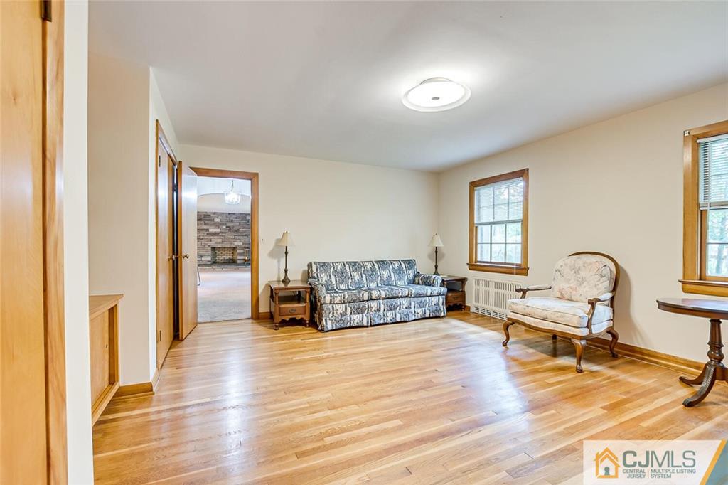 305 Ridge Road Watchung, NJ 07069 - Photo 10 of 41 a living room with furniture and a wooden floor