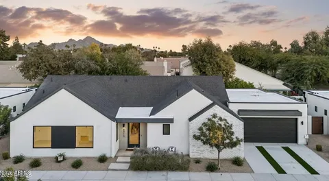 a aerial view of a house with a yard and garage