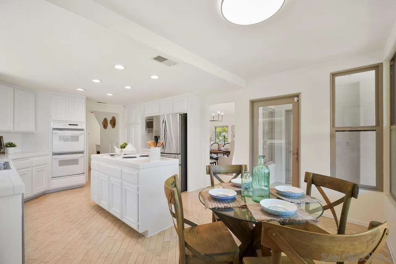 263 Via Villena Encinitas, CA 92024 - Photo 11 of 49 a living room with furniture and a kitchen