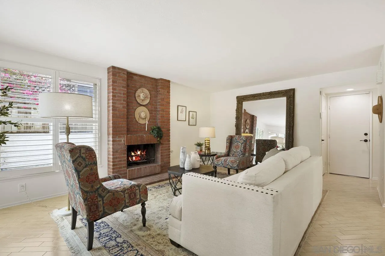 263 Via Villena Encinitas, CA 92024 - Photo 15 of 49 a living room with furniture mirror and fireplace