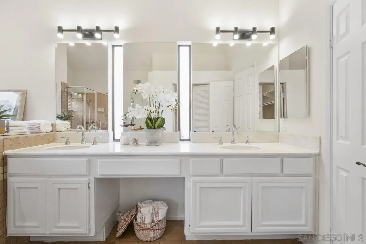 263 Via Villena Encinitas, CA 92024 - Photo 20 of 49 a bathroom with a sink vanity and mirror