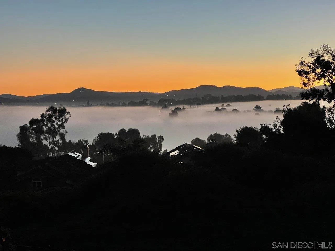 263 Via Villena Encinitas, CA 92024 - Photo 31 of 49 a view of a lake with a mountain in the background